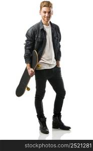 Studio portrait of a young man posing with a skateboard