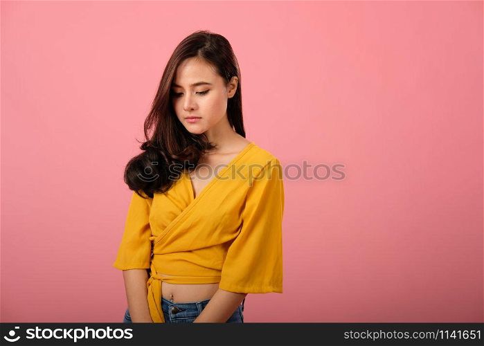 studio portrait of asian woman in casual clothing feeling sad unhappy sorry depressed
