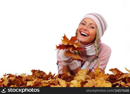 studio portrait of autumn woman in yellow leaves