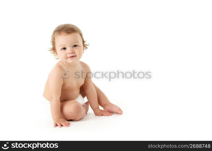 Studio Portrait Of Baby Boy Sitting