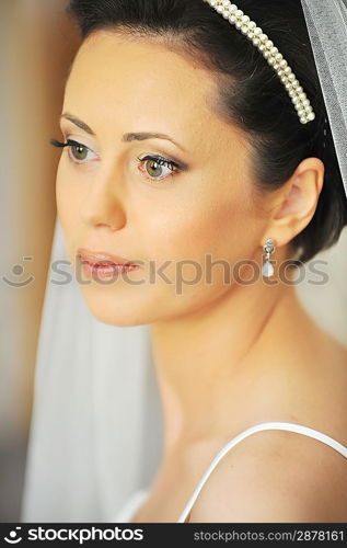 Studio portrait of beautiful stylish bride