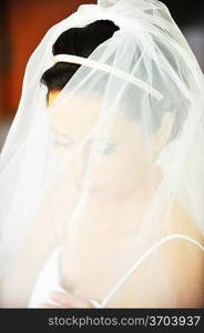 Studio portrait of beautiful stylish bride