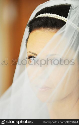 Studio portrait of beautiful stylish bride