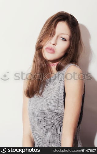 Studio portrait of beautiful young girl on white background