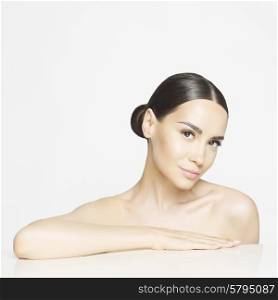 Studio portrait of beautiful young woman with perfect skin. Beauty and care. Spa salon