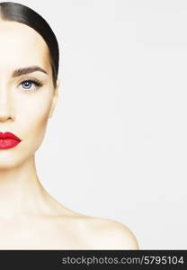 Studio portrait of beautiful young woman with perfect skin. Beauty and care. Spa salon. Red lipstick