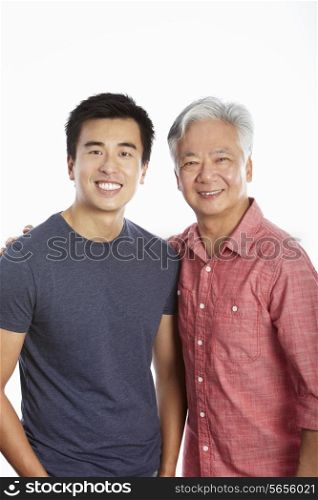 Studio Portrait Of Chinese Father With Adult Son