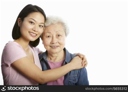 Studio Portrait Of Chinese Mother With Adult Daughter