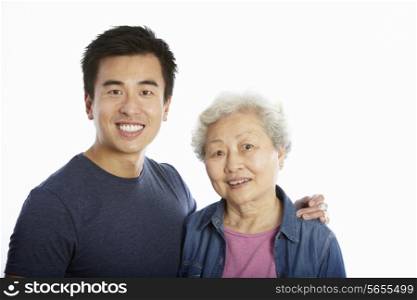 Studio Portrait Of Chinese Mother With Adult Son