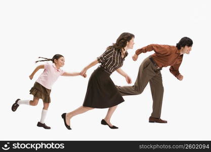 Studio portrait of family running