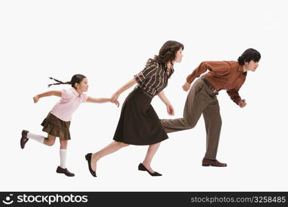 Studio portrait of family running