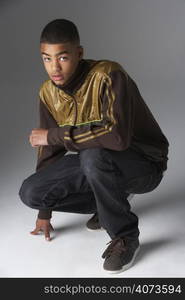 Studio Portrait Of Fashionably Dressed Teenage Boy