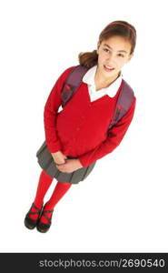 Studio Portrait Of Female Student In Uniform With Backpack