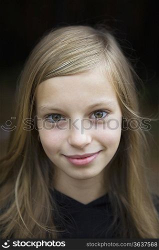 Studio portrait of girl smiling