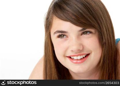 Studio Portrait Of Happy Teenage Girl