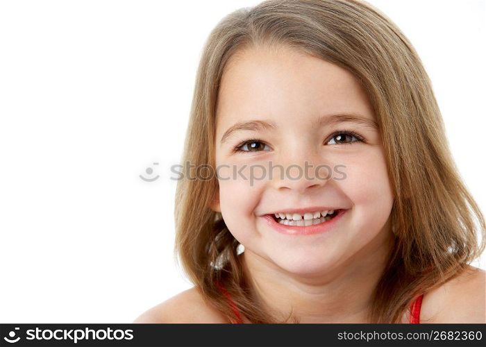 Studio Portrait Of Happy Young Girl