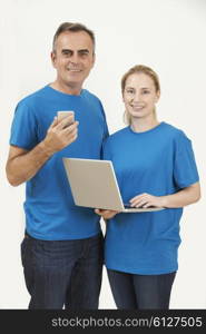 Studio Portrait Of IT Support Staff Wearing Uniform Against White Background