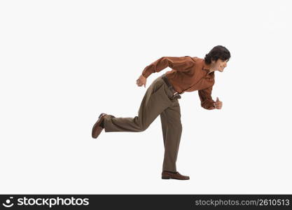 Studio portrait of man running