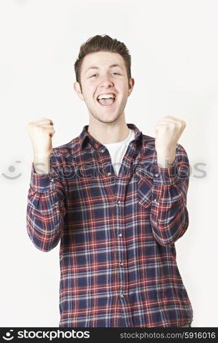 Studio Portrait Of Man With Jubilant Expression