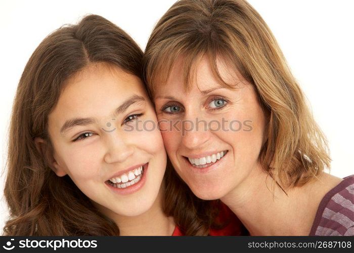 Studio Portrait Of Mother And Daughter