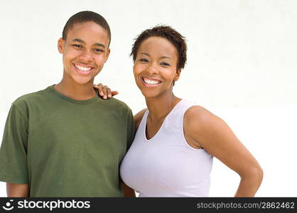 Studio portrait of mother and son smiling