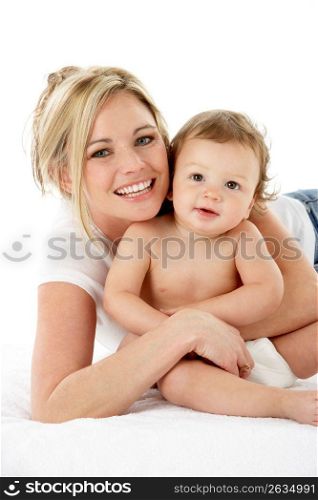 Studio Portrait Of Mother With Young Baby Boy