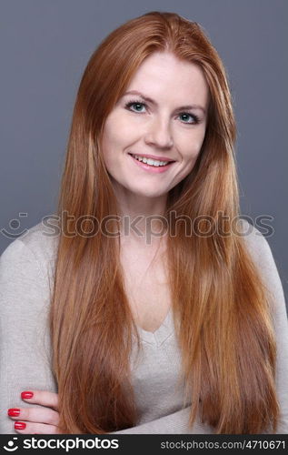 Studio portrait of red-haired girl