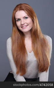 Studio portrait of red-haired girl