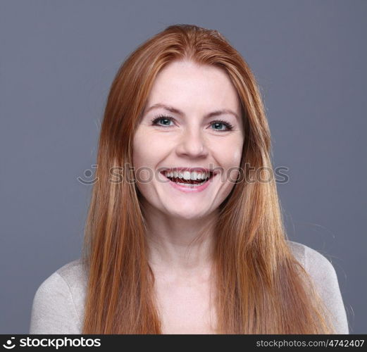 Studio portrait of red-haired girl