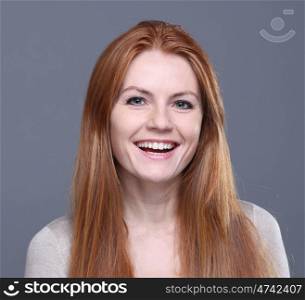 Studio portrait of red-haired girl