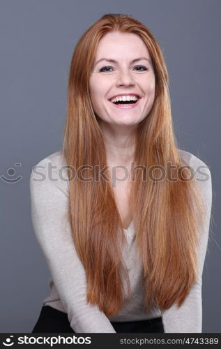 Studio portrait of red-haired girl