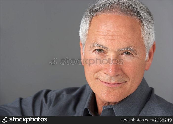 Studio Portrait Of Senior Man