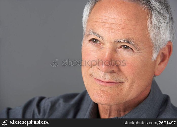 Studio Portrait Of Senior Man