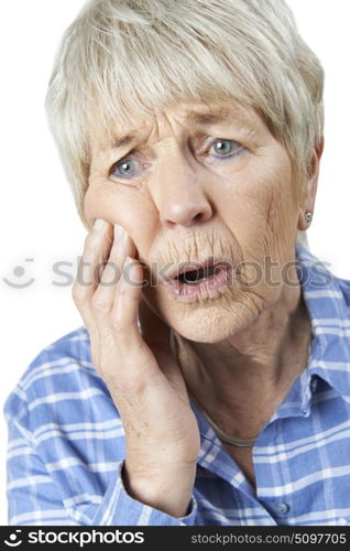 Studio Portrait Of Senior Woman Suffering With Toothache