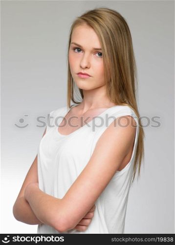 Studio Portrait Of Serious Teenage Girl