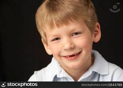 Studio Portrait Of Smiling Boy