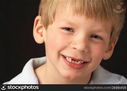 Studio Portrait Of Smiling Boy