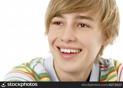 Studio Portrait Of Smiling Teenage Boy
