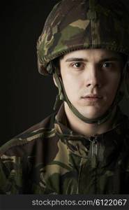 Studio Portrait Of Soldier In Uniform