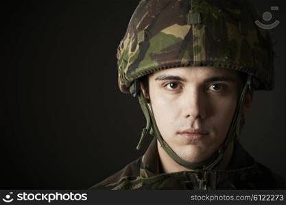 Studio Portrait Of Soldier In Uniform