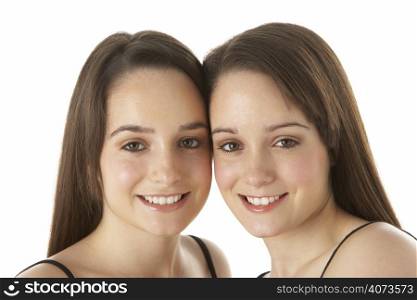 Studio Portrait Of Teenage Twins