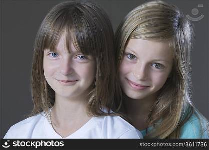 Studio portrait of two girl smiling