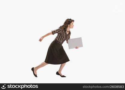 Studio portrait of woman running