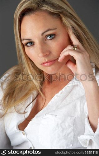 Studio Portrait Of Woman Wearing White Shirt