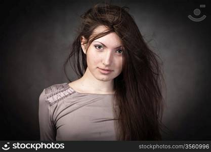 studio portrait of woman with long hair