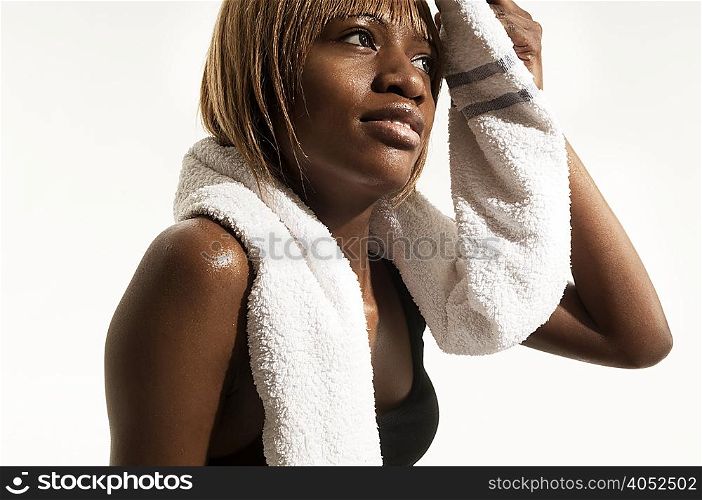 Studio portrait of woman with towel