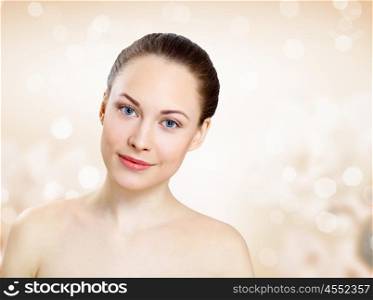 Studio portrait of young beautiful woman natural look