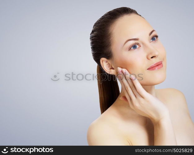 Studio portrait of young beautiful woman natural look