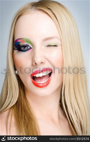 studio portrait of young caucasian woman with creative make-up