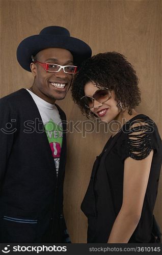 Studio portrait of young couple smiling